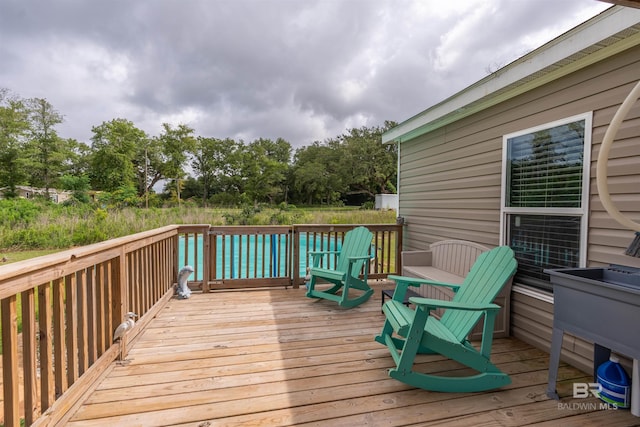 11691 Grantham Rd, Foley, AL 36535 - wooden terrace featuring view of wooded area