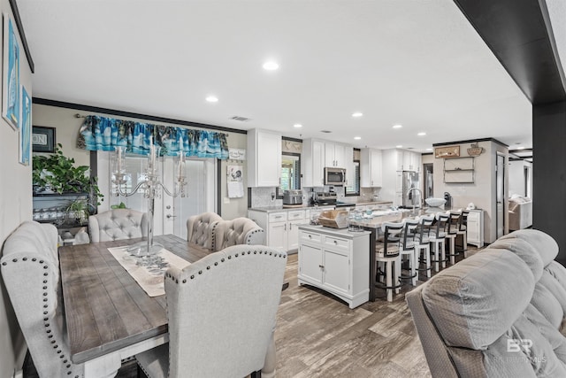 11691 Grantham Rd, Foley, AL 36535 - dining area featuring recessed lighting, light wood-style floors, and crown molding