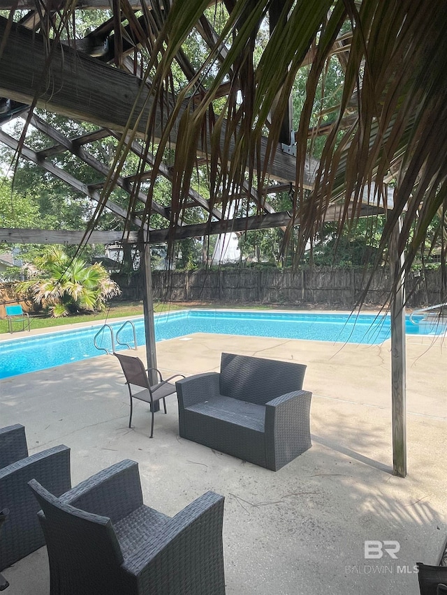 view of swimming pool featuring a patio