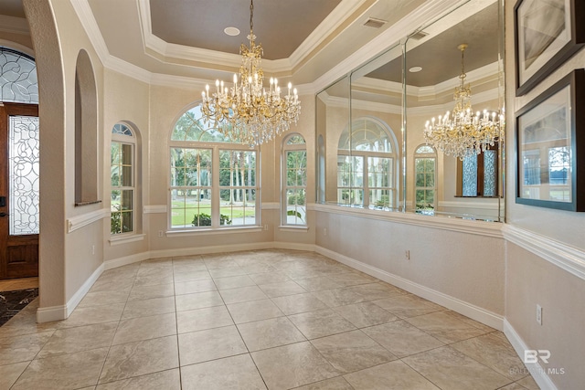 interior space with a chandelier, visible vents, baseboards, a tray ceiling, and crown molding