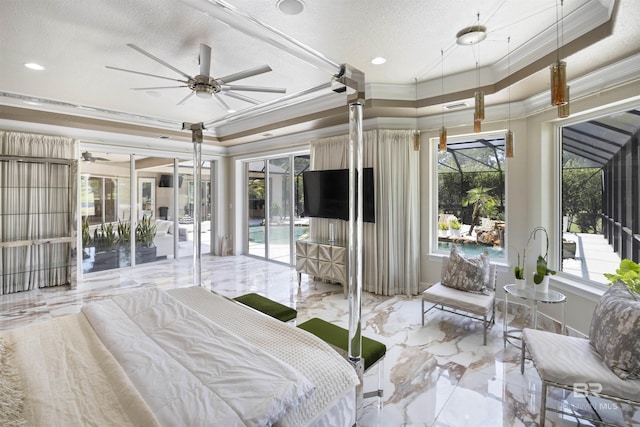 bedroom featuring multiple windows, a tray ceiling, and crown molding