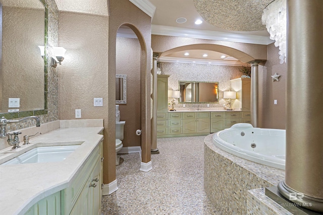 bathroom with toilet, ornamental molding, a sink, two vanities, and recessed lighting