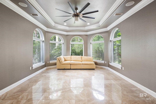 unfurnished room with a healthy amount of sunlight, baseboards, and visible vents