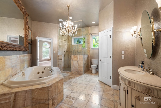 full bathroom with toilet, plenty of natural light, a notable chandelier, and vanity