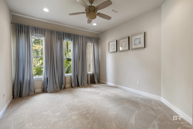 unfurnished room featuring light carpet, baseboards, visible vents, and recessed lighting