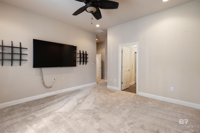 unfurnished living room with baseboards, light colored carpet, a ceiling fan, and recessed lighting