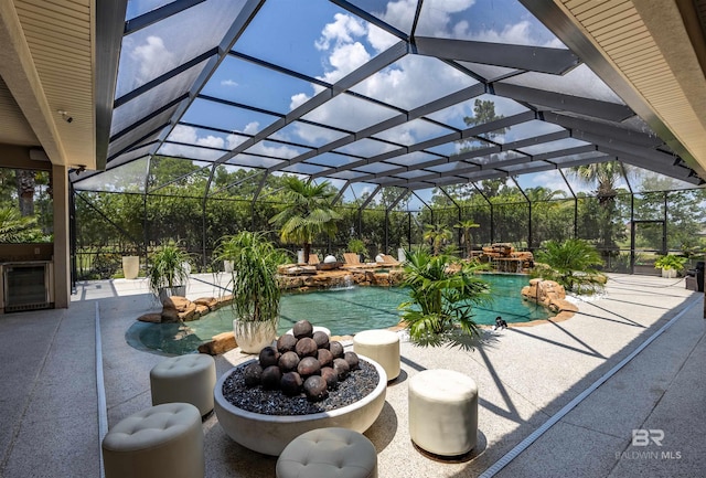 pool with a patio and a lanai