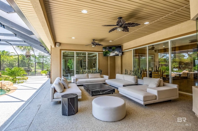 view of patio / terrace featuring ceiling fan, outdoor lounge area, and a lanai