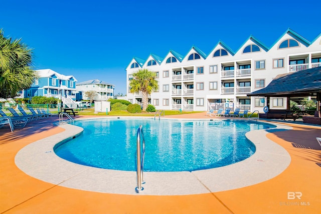 view of pool featuring a patio area