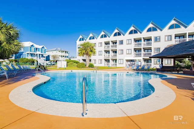 community pool featuring a patio area