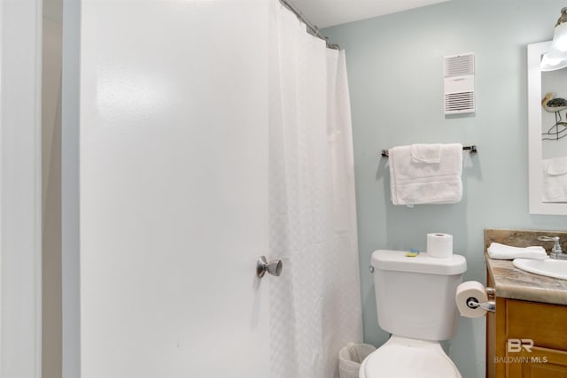 full bath featuring toilet, visible vents, and vanity