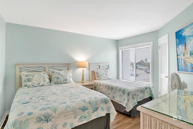 bedroom featuring a closet and light hardwood / wood-style floors