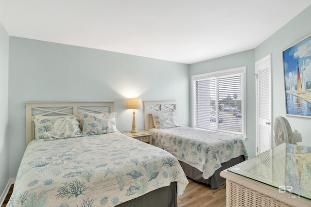 bedroom featuring light wood-style flooring