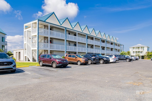 view of property with uncovered parking