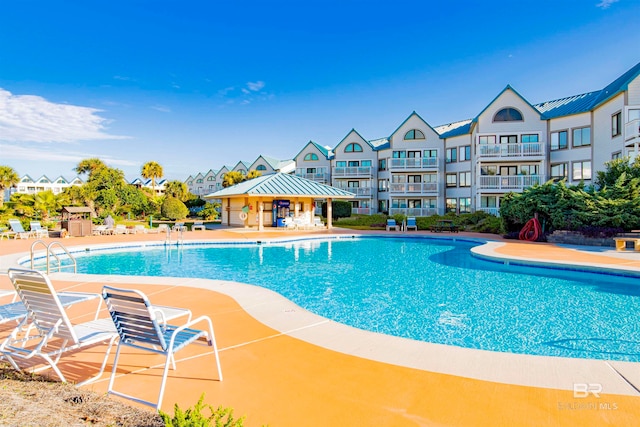 view of swimming pool with a gazebo and a patio