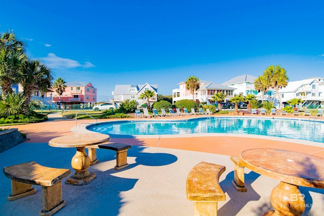 view of swimming pool with a patio