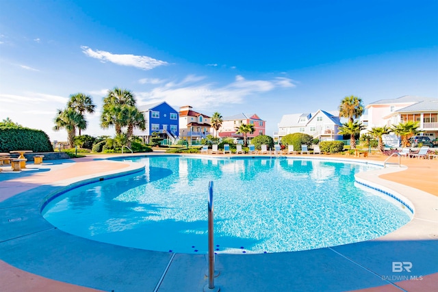 view of swimming pool with a patio