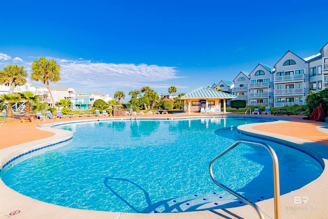 view of swimming pool with a gazebo and a patio area