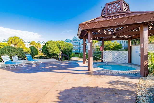 view of pool with a patio and a gazebo