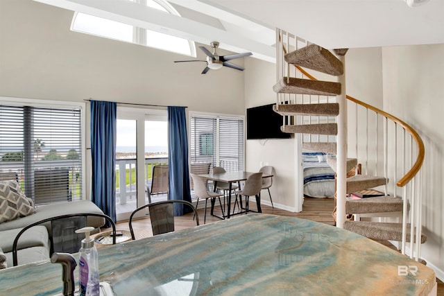 interior space with a high ceiling and hardwood / wood-style flooring