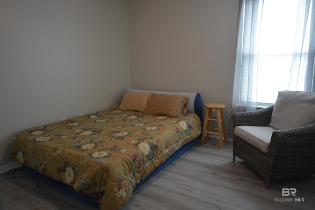 bedroom featuring wood finished floors