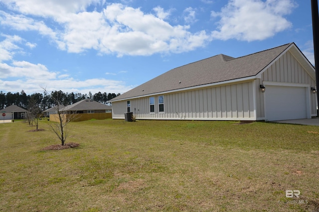 view of home's exterior with a lawn, driveway, board and batten siding, roof with shingles, and a garage