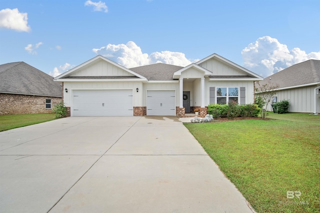 view of front of home with a front lawn and a garage