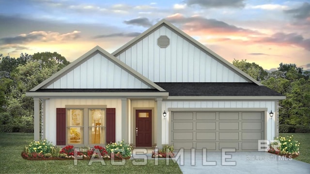 view of front of home featuring a lawn and a garage