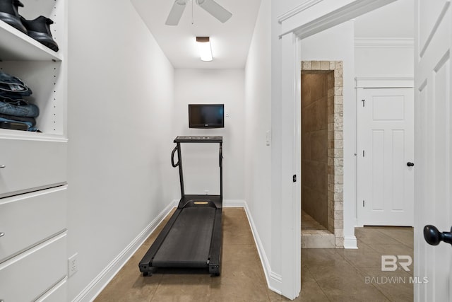 exercise room featuring ceiling fan and tile patterned floors