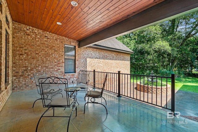 view of patio featuring a balcony