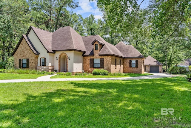 view of front facade with a front lawn and a garage