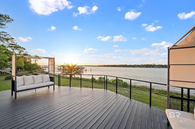 wooden deck with a water view and outdoor lounge area