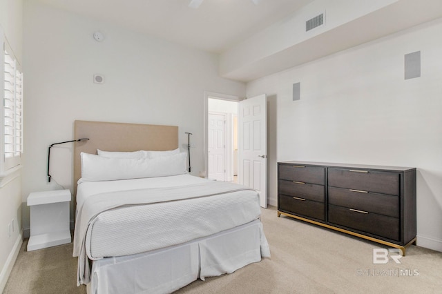 bedroom featuring light carpet and ceiling fan