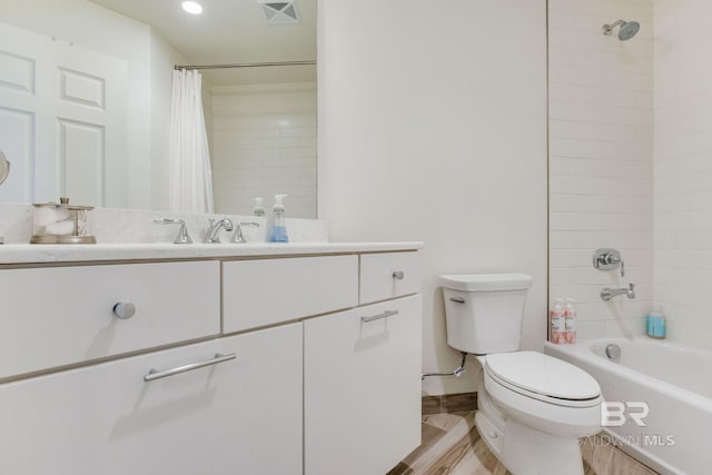 full bathroom with shower / bath combo with shower curtain, vanity, and toilet