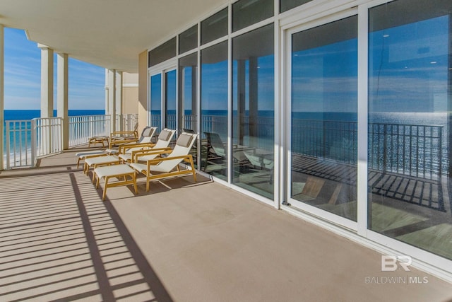 balcony featuring a water view