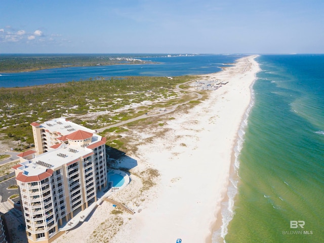 bird's eye view featuring a water view and a view of the beach