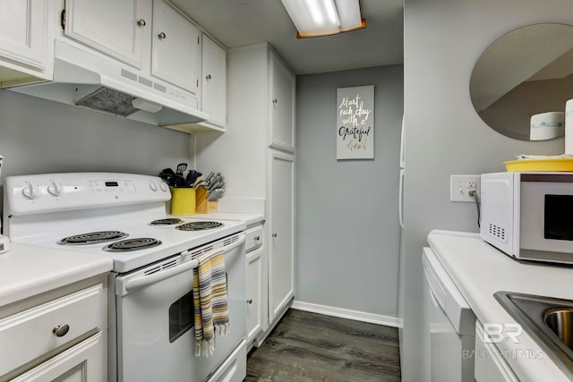 kitchen featuring white cabinets, dark hardwood / wood-style floors, sink, and white appliances