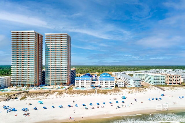 birds eye view of property with a view of the beach and a water view