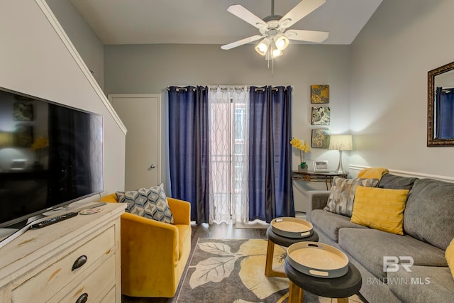 living room with ceiling fan and hardwood / wood-style floors