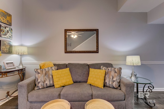 living room with ceiling fan and hardwood / wood-style flooring