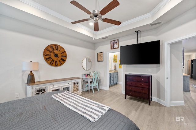 bedroom with light wood finished floors, visible vents, ornamental molding, and baseboards