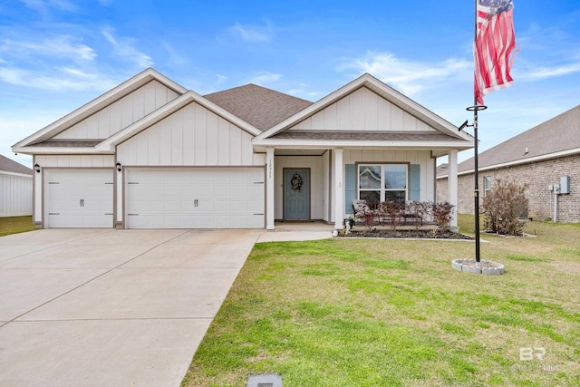 view of front facade with a garage, concrete driveway, a front lawn, and a shingled roof