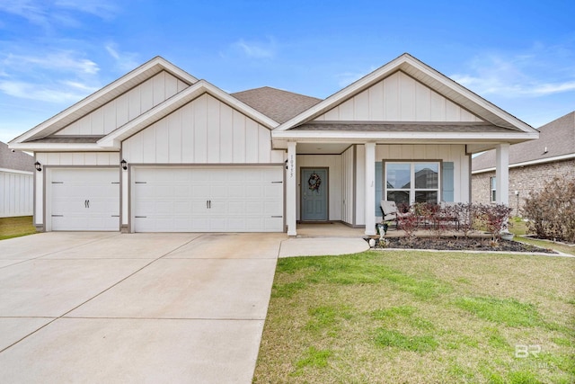 view of front of house featuring a garage, driveway, a shingled roof, board and batten siding, and a front yard