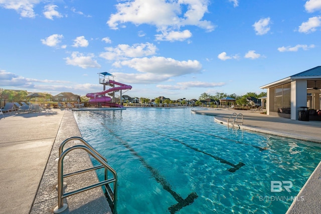 view of pool featuring a water slide