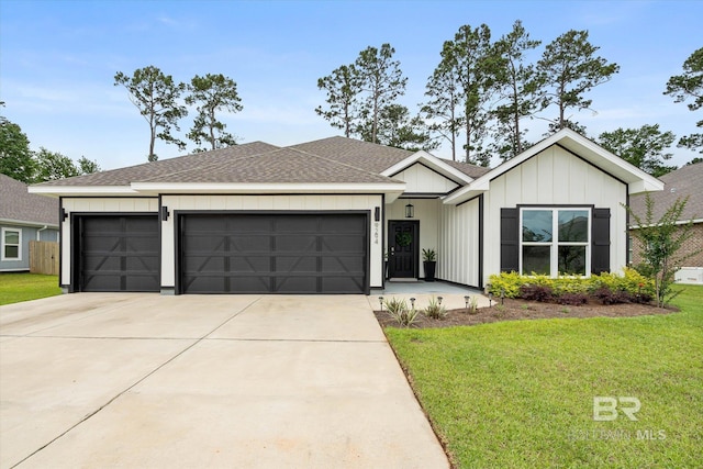 view of front of home with a garage, driveway, a front yard, and roof with shingles