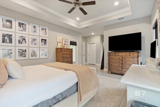 bedroom featuring crown molding, recessed lighting, a raised ceiling, ceiling fan, and baseboards