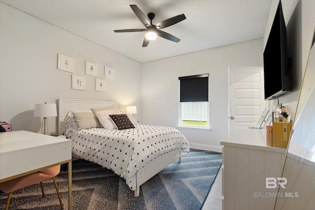bedroom featuring baseboards and ceiling fan