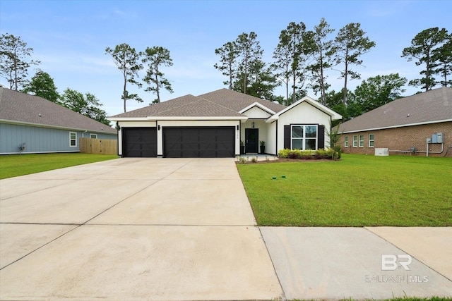 single story home with a garage and driveway