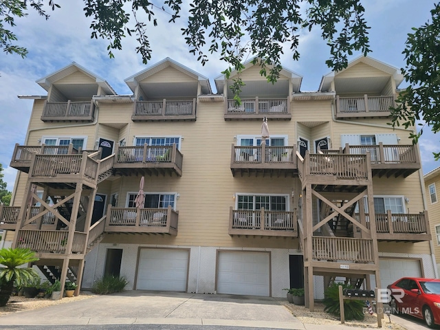 view of building exterior with driveway and an attached garage