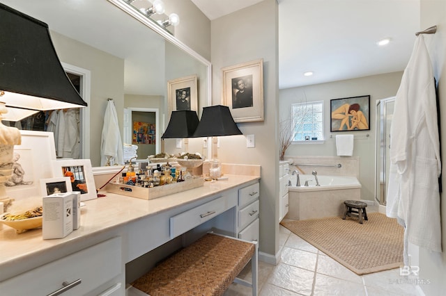 bathroom with shower with separate bathtub, tile flooring, and vanity